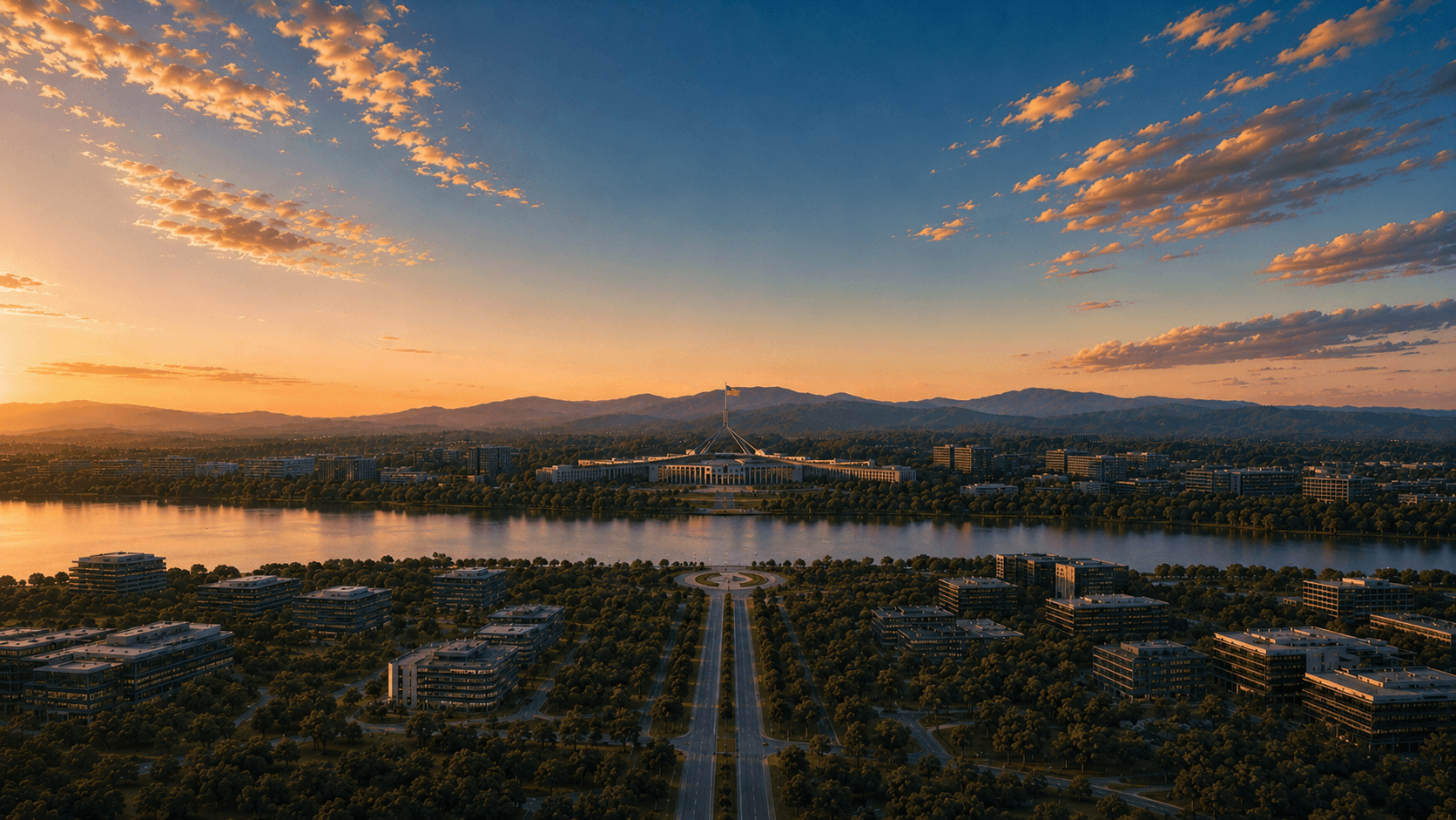Aerial view of a capital city at sunset — lake, parliament and tree-lined avenues